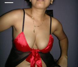desinakedgirls:  Hot Matured Indian Aunty Posing in Sexy Red Skimpy Lingerie 