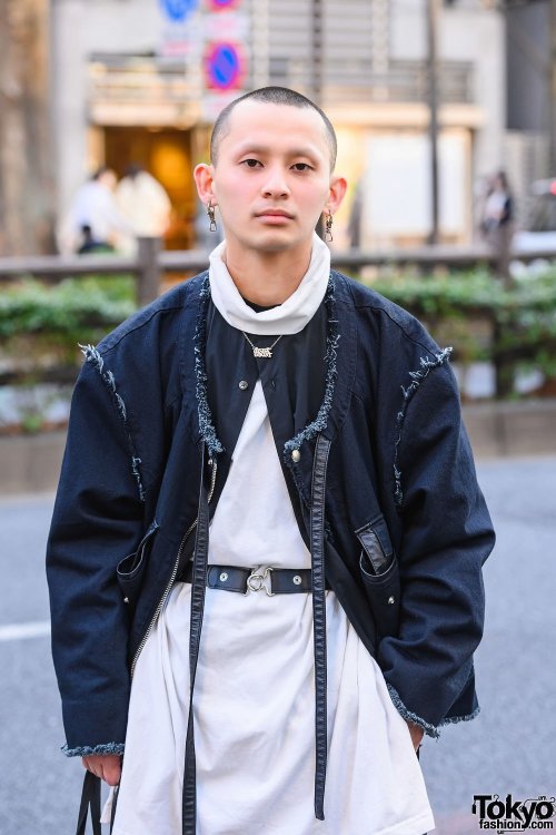 Japanese apparel worker Takamitsu on the street in Harajuku wearing a jacket and top from Not Conven