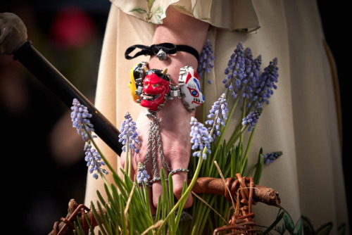 gucci:  Bracelets featuring enamel faces and wooden canes, the eclectic accessories of Gucci Fall Wi