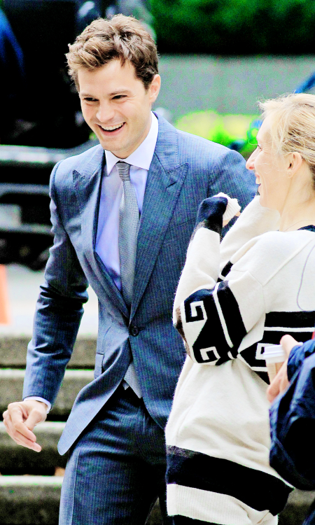 fiftyshadesofgreyinspiration:    Jamie Dornan and Sam Taylor Johnson -  Fifty Shades of Grey reshoots  source:jamie-dornan.org   I love his smile, my smail.