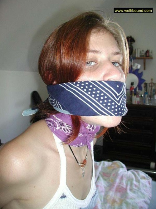 graybandanna:  While she was still bandanna bound and gagged, at least the captor was nice enough to remove the scarf stuffing and the bandanna tied over her mouth