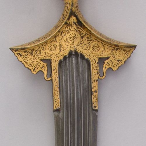 art-of-swords:Chilanum Dagger with SheathDated: 18th centuryCulture: IndianMedium: Iron, gold, leatherMeasurements: H. with sheath 16 3/8 in. (41.6 cm); H. without sheath 15 1/4 in. (38.7 cm); H. of blade 10 13/16 in. (27.5 cm); W. 3 9/16 in. (9 cm);