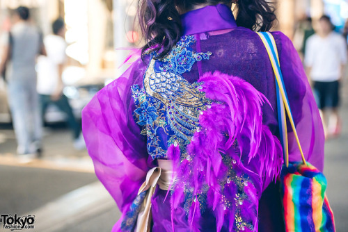 Japanese art student Chami on the street in Harajuku at night wearing a kimono coat from the iconic 