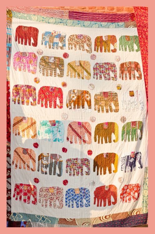 Hand-made elephant pattern quilt in Thamel, Kathmandu, Nepal.  I wanted to buy it so bad. :&