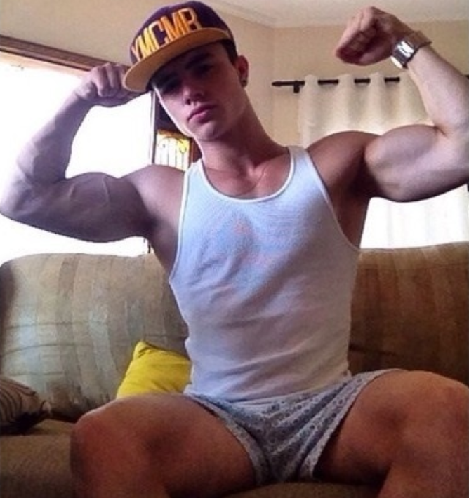 texasfratboy:  yummy bad boy in boxers and a wife beater! love hi big biceps and
