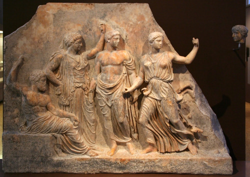 lionofchaeronea:Zeus (seated) and Leto with their offspring Apollo and Artemis.  Marble relief from 