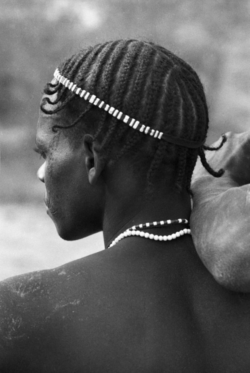 Young man with braids, unknown.