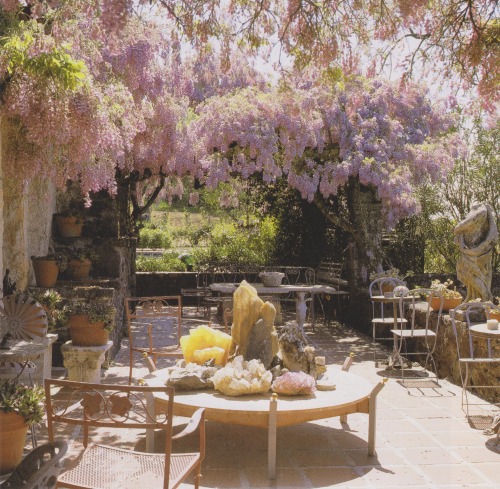 vintagehomecollection: An arbor of wisteria offers shade and fragrance to a terrace garden. An arran