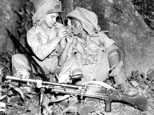 historicaltimes:American and Chinese soldiers share cigarettes in Burma, 1943 via reddit