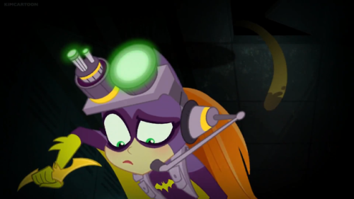 Fully equipped, Batgirl is searching the school for the “monster” and tracking everyone’s movement. 