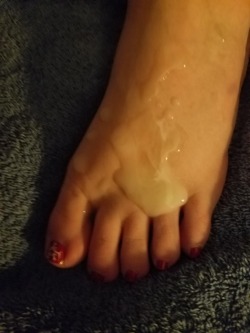 blondie4blackmen:  Two loads of cum on my foot. Both are hubs and he licked both off.