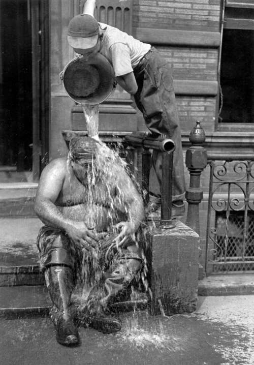 Construction worker on 41st Street takes a break during August 1947 heat wave