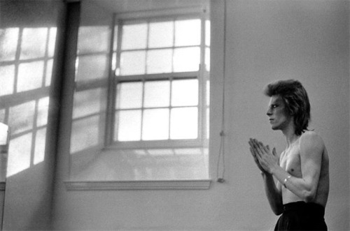 zzzze:  Mick Rock David Bowie praying by windows, Scotland, Summer 1973. Gelatin silver print  Mick Rock specializes in rock n roll photography and is known as “The Man Who Shot the 70s.” He is the inimitable rock.