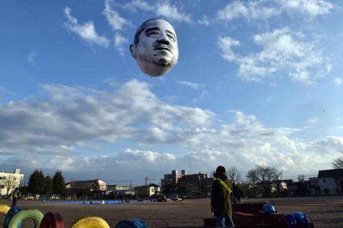 shihlun: A giant helium balloon bearing the face of an ojisan (middle-aged man) appeared in the sky 