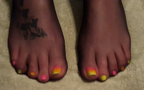 mytalentedtoes:She’s such a tease So hot. Her toes look like tasty little candy corns.