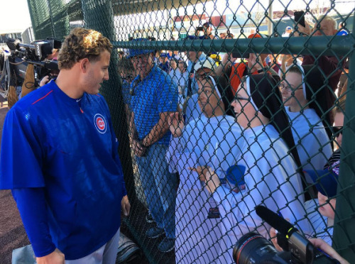 Chicago Cubs’ Anthony Rizzo shares a moment with some nuns.  Pretty sure they’re asking for another 