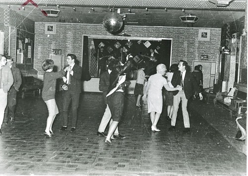 ‪The Beatles performing for a roaring crowd of 18 people at the Palais Ballroom in Aldershot. Decemb