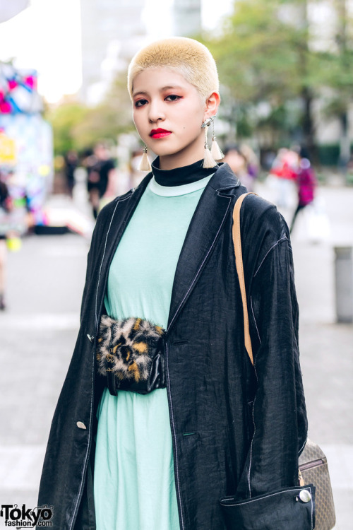 tokyo-fashion:  Saki and Rabu on the street in Tokyo with short hairstyles and fashion including a GVGV coat, Toga Japan dress, leather harness, vintage faux fur waist bag, tassel earrings, and snakeskin platform boots. Full Looks