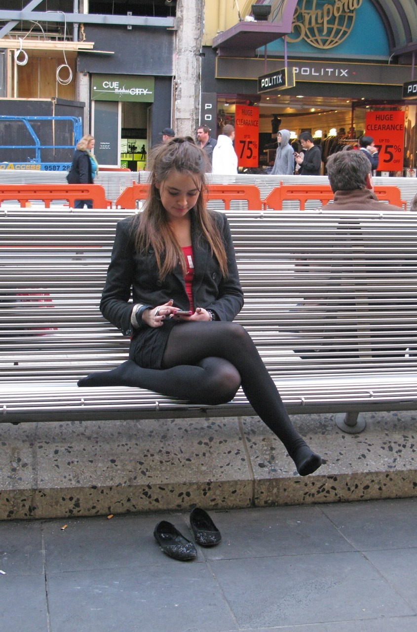 in-pantyhose:  Classy girl in black opaque pantyhose on a bench. Woman in pantyhose