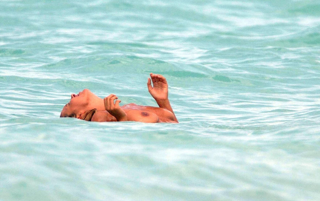 toplessbeachcelebs:  Jodie Marsh (British Model) swimming topless in The Caribbean (May