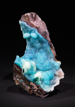 bijoux-et-mineraux:  Extremely rare Tridymite Crystobalite Opal - Khorixas, Brandberg West, Namibia Found in spring 2014, this specimen is one of the finest of its kind. The striking turquoise Paraiba-color is caused by copper. 