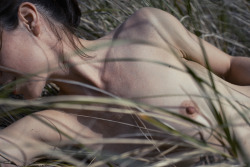 arealitystudios:  I adore the strands of hair falling along the model’s neck in this image. They almost mimic the blades of grass and the earthy tones of the hair seem like perfect compliments to the overwhelming green bursting from the frame. Maybe