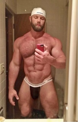 iammegadaddyissues:Men in jockstraps have always intimidated me.  To me, the jockstrap signifies athleticism and raw, rugged masculinity, two things i’ve never possessed. His huge muscles, the heavy beard, the look on His face - everything about the