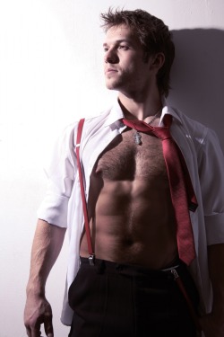 Nipples and suspenders in suit and tie