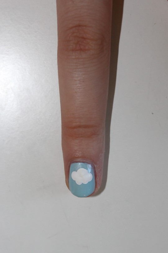 Premium Photo | A nail art design with clouds and the sky