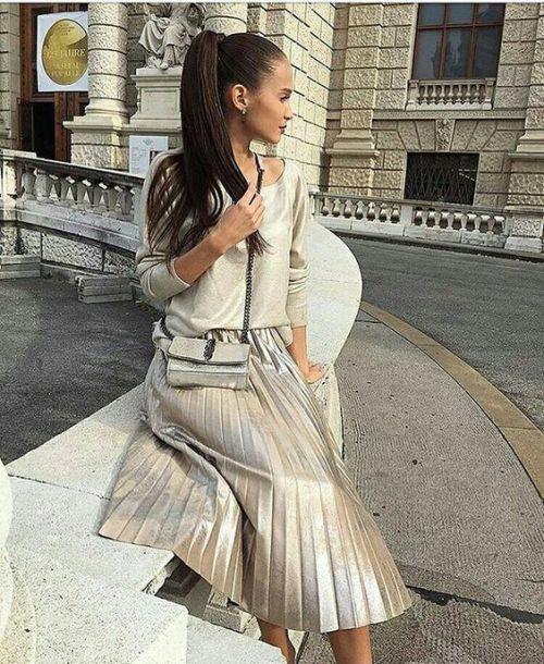 Silvery pleated skirt teamed will a comfortable sweater