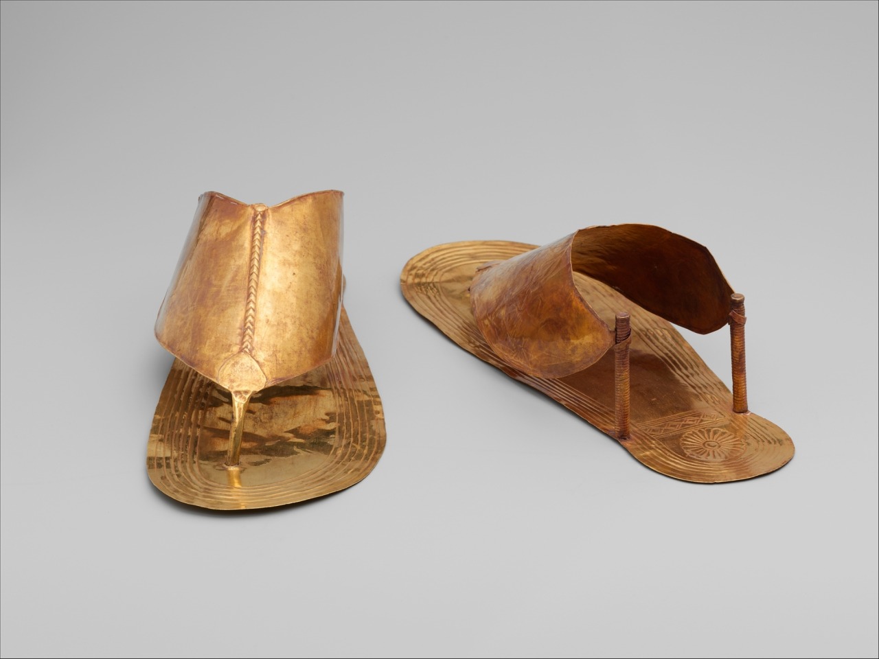 “ Gold Sandals
New Kingdom; Dynasty 18; reign of Thutmose III, ca. 1479–1425 B.C.
‘These Gold sandals belonged to the funerary accoutrements of an Egyptian queen of Thutmose III in the middle of Dynasty 18.’
”