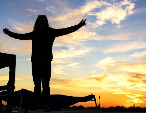 Sunset Art… An artist celebrates his latest project on the Warehouse Artist Lofts rooftop. (P