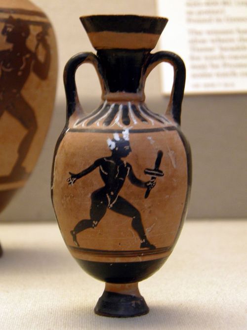 A torch-racer.  Black-figure Panathenaic amphoriskos, artist unknown; ca. 400 BCE.  Found at Eretria