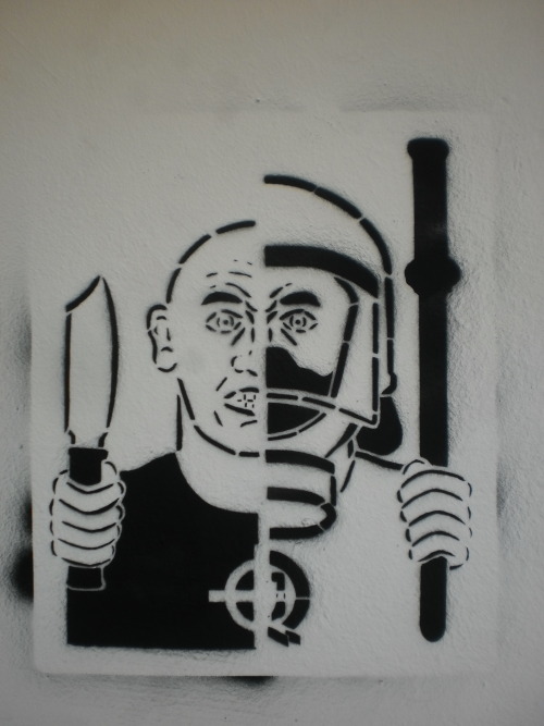 fuckyeahanarchistgraffiti:Stencil in Athens in May 2011, Riot cops and Nazi thugs one and the same.S