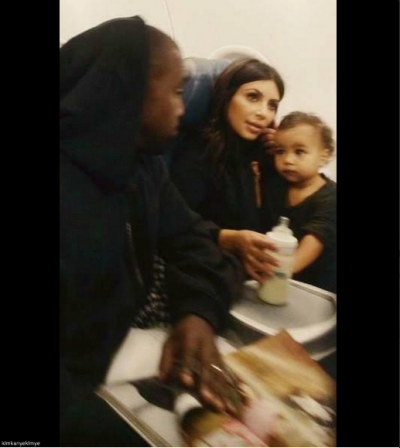 kimkanyekimye:
“ Fan taken photo of Kanye, Kim, and North on a flight.
”