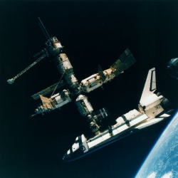 humanoidhistory:  The Space Shuttle Atlantis docked with Russia’s Mir Space Station, photographed by the Mir-19 crew on July 4, 1995. (NASA)