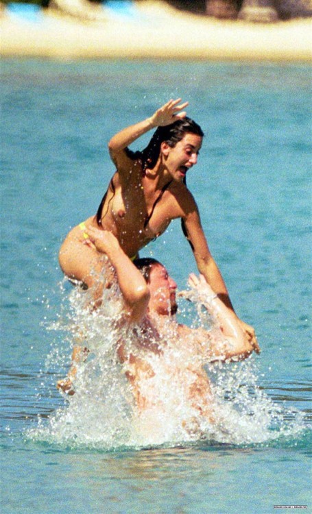 toplessbeachcelebs:  Penelope Cruz (Actress) swimming topless on the beach (February 2002) 