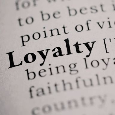 a page of a book zoomed in on the word Loyalty