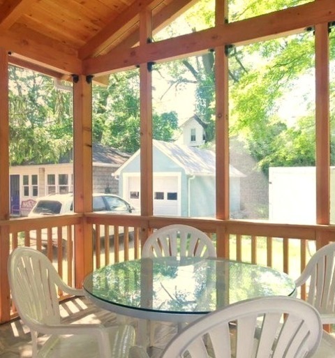 Baltimore PorchMid-sized Arts And Crafts Tile Screened-in Back Porch Photo With A Roof Extension
