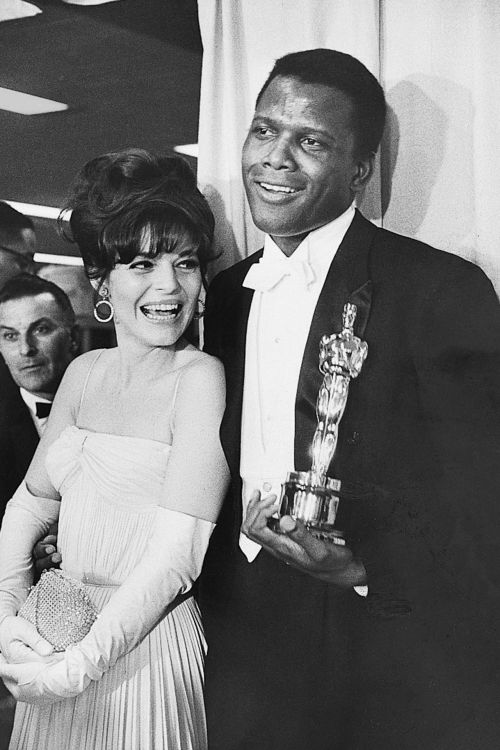 vintageeveryday:Sidney Poitier holding his Oscar Best Actor statuette backstage at the Academy Award
