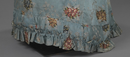Silk brocade dress from the 1820sIf looking closer, it becomes clear the hem is a patchwork of scrap
