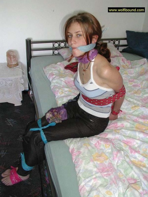 graybandanna:  While she was still bandanna bound and gagged, at least the captor was nice enough to remove the scarf stuffing and the bandanna tied over her mouth