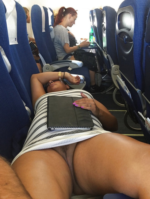 carelessinpublic:  In a short dress and showing her pussy inside an airplane