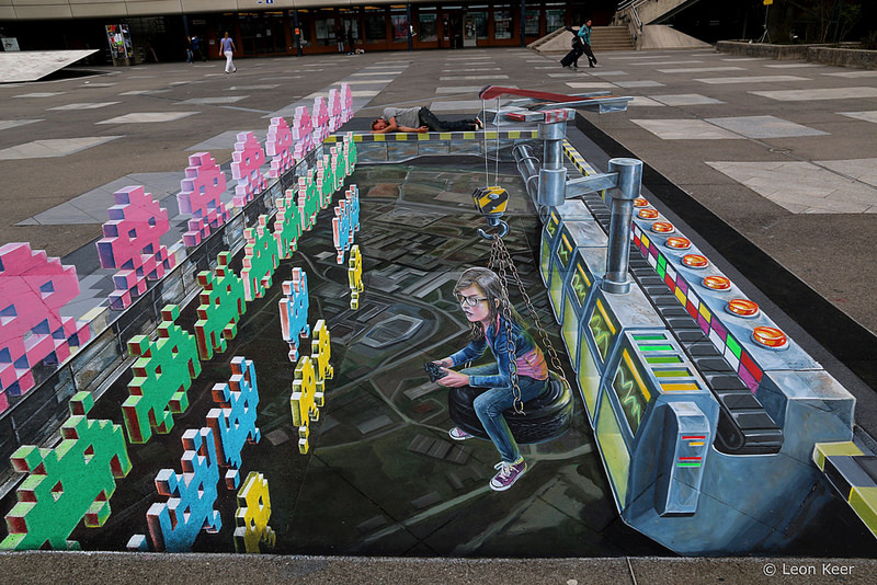 huffingtonpost:  3D Space Invader street art is the best use of chalk. (Source: Leon