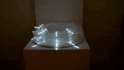 sixpenceee:This 3D-printed zoetrope reveals dancing and walking people when lit from the side. Desig