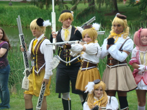 terribletardis:  AnimeNext pics pt2:Madoka photoshoot  Yay!  Pictures of the Kyokos :’)  I’m the one with the spear for most of the pics (as well as my oops face as I’m eating Pocky hah). Also, the Sayaka farthest right is appledress