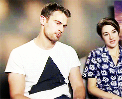 divergents:  Theo James + playing with his shirt 