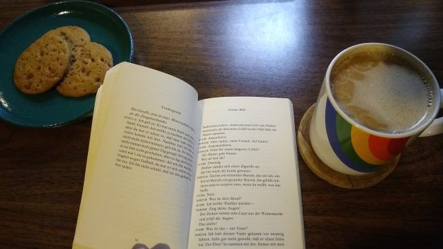 a photo of a plate of cookies, a hot drink, and max frisch's andorra, open to a page titled "viertes bild"