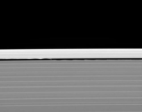 Ripples in the rings of Saturn caused by the orbit of small moons (Pandora, Pan, Prometheus, Atlas, 