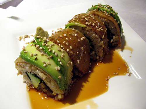 Vegan Sushi - Dragon Roll Avocado inside, Seitan and avocado outside with sweet soy sauce.Check your